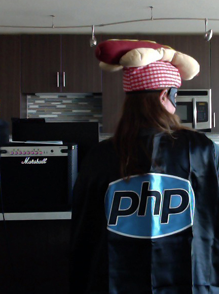 Amanda wearing a PHP cape and a hotdog hat.